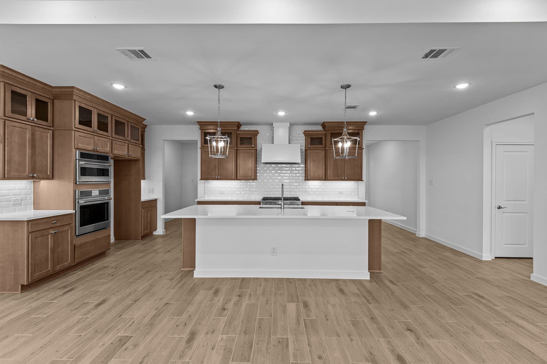 Kitchen with stained cabinets & upper glass cabinetry