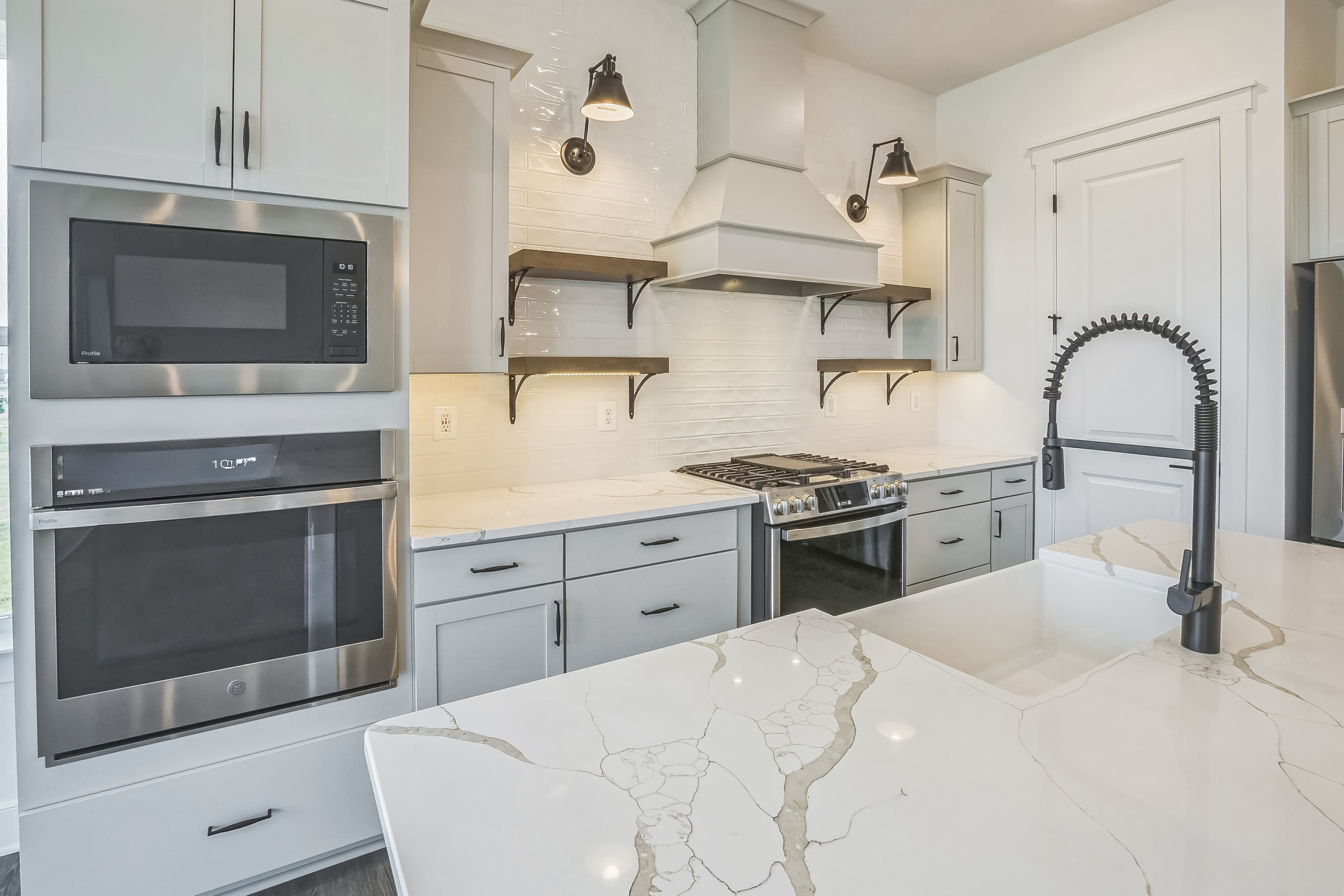 Kitchen with stylish floating shelves