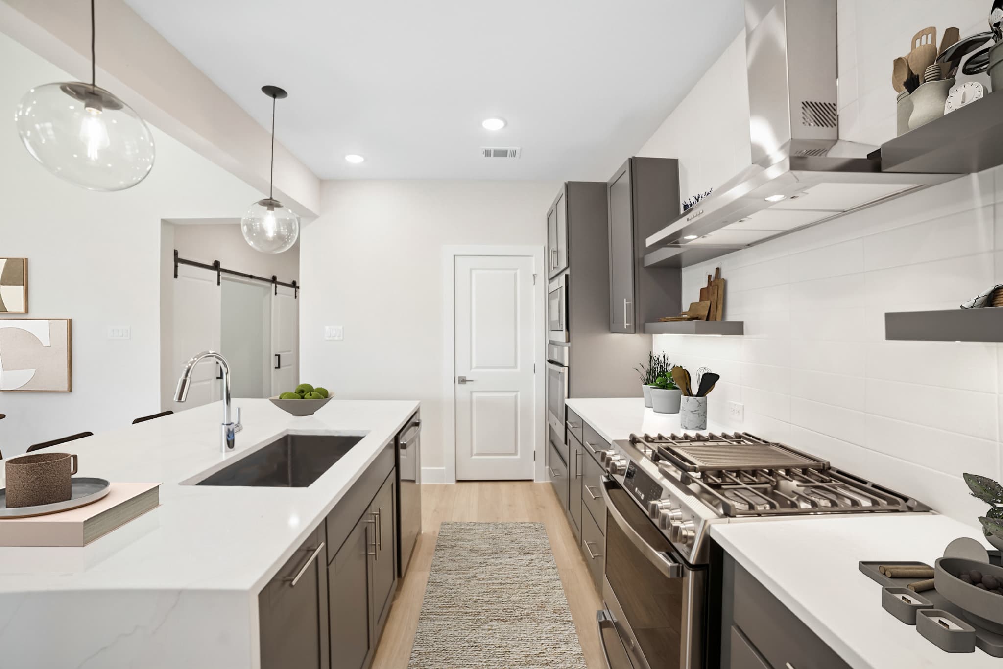 Kitchen with pendant lighting & floating shelves