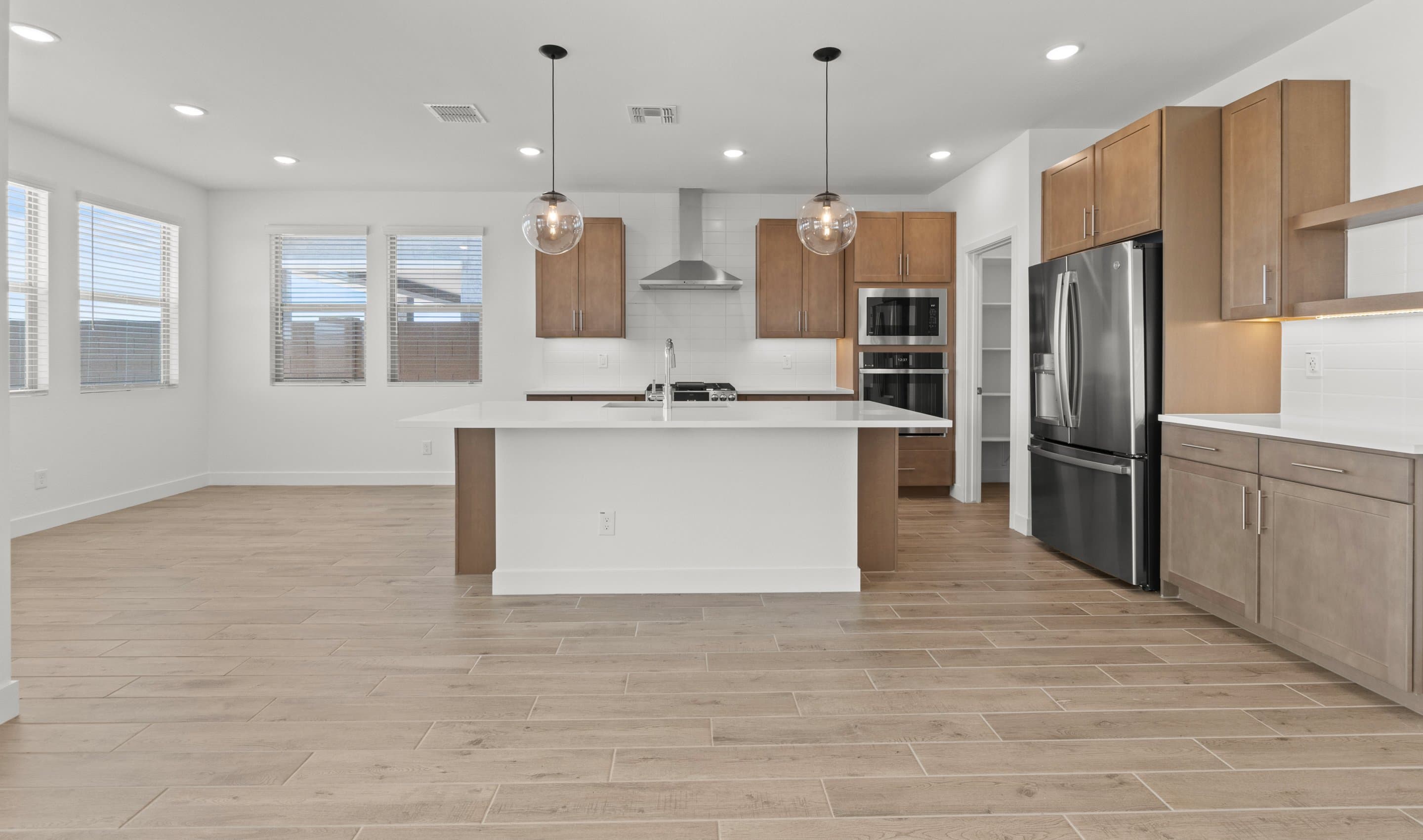 Kitchen with pendant lighting & floating shelves