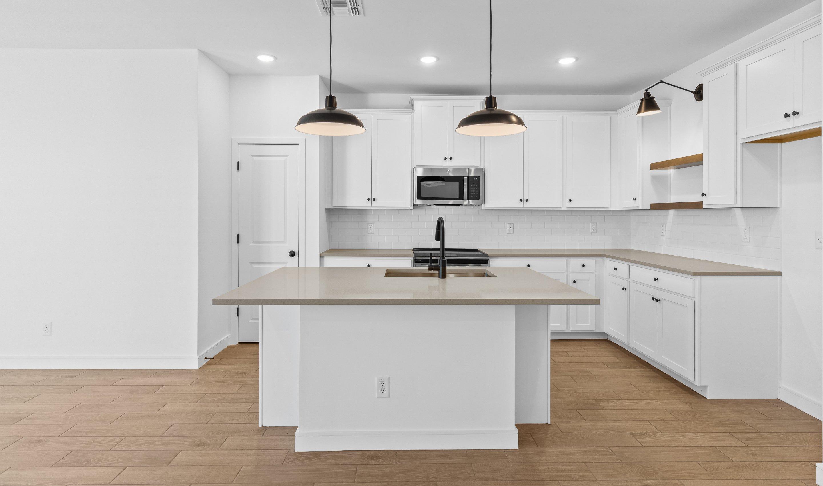 Kitchen with pendant lights & floating shelves