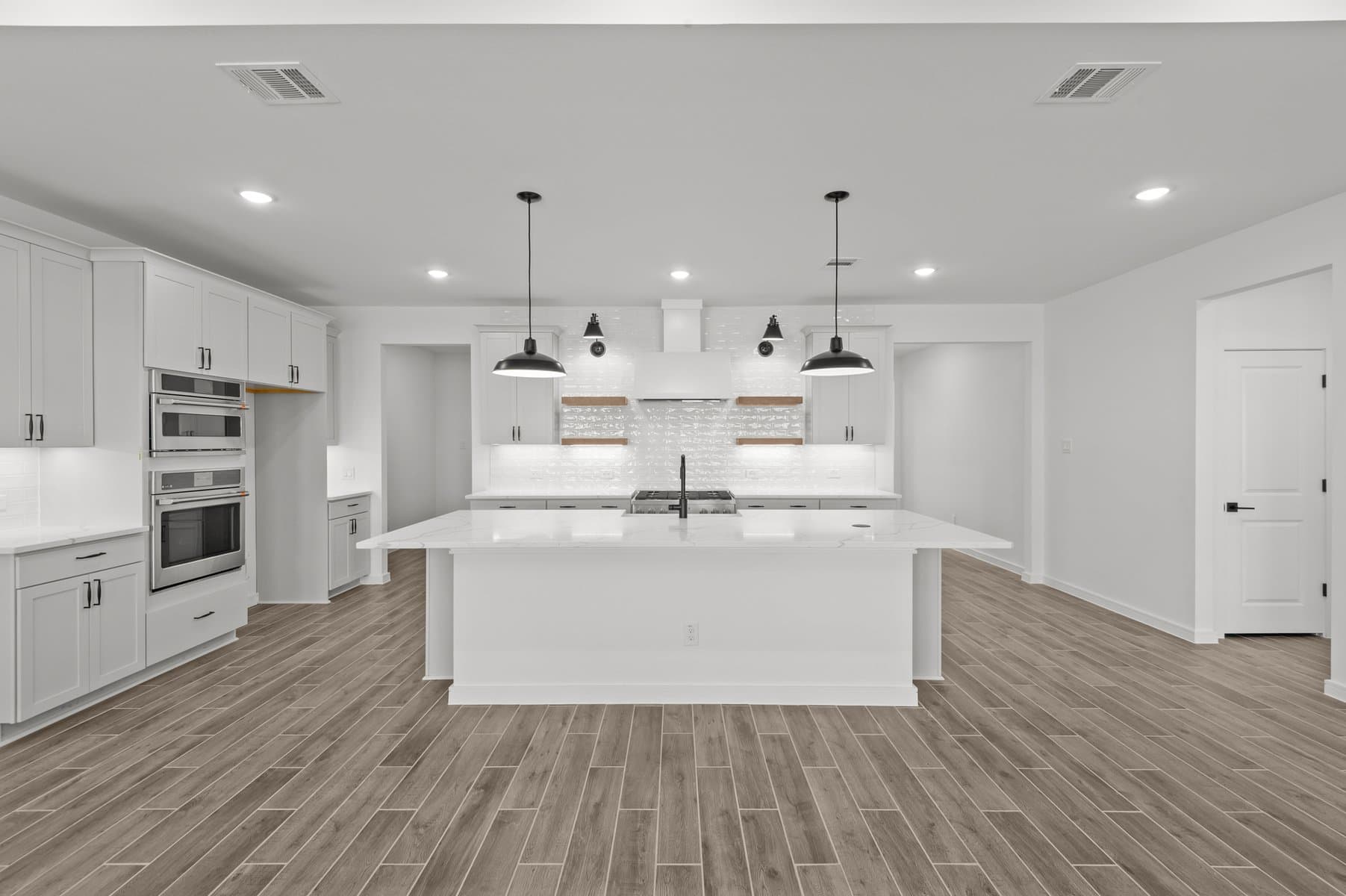 Kitchen features Brellin White cabinets & floating shelves
