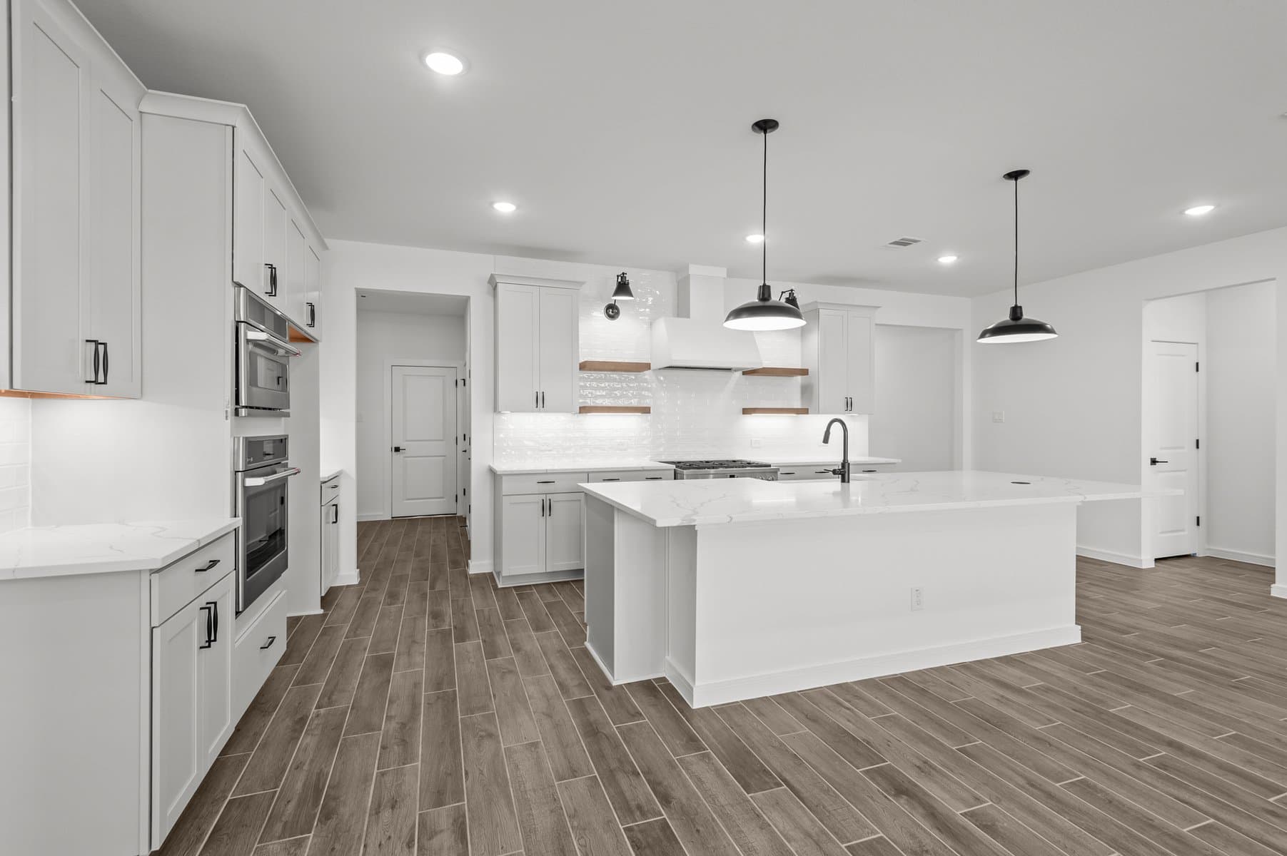 Kitchen with pendant lights over island