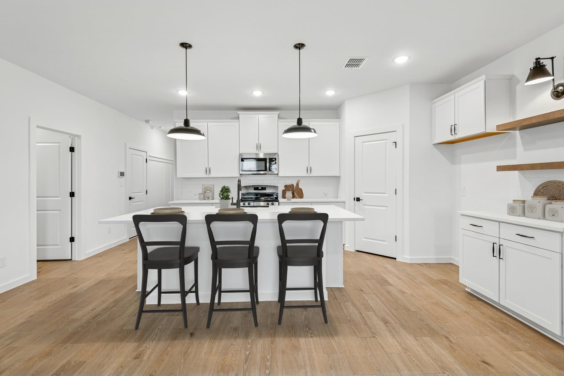 Kitchen with pendant lighting & floating shelves
