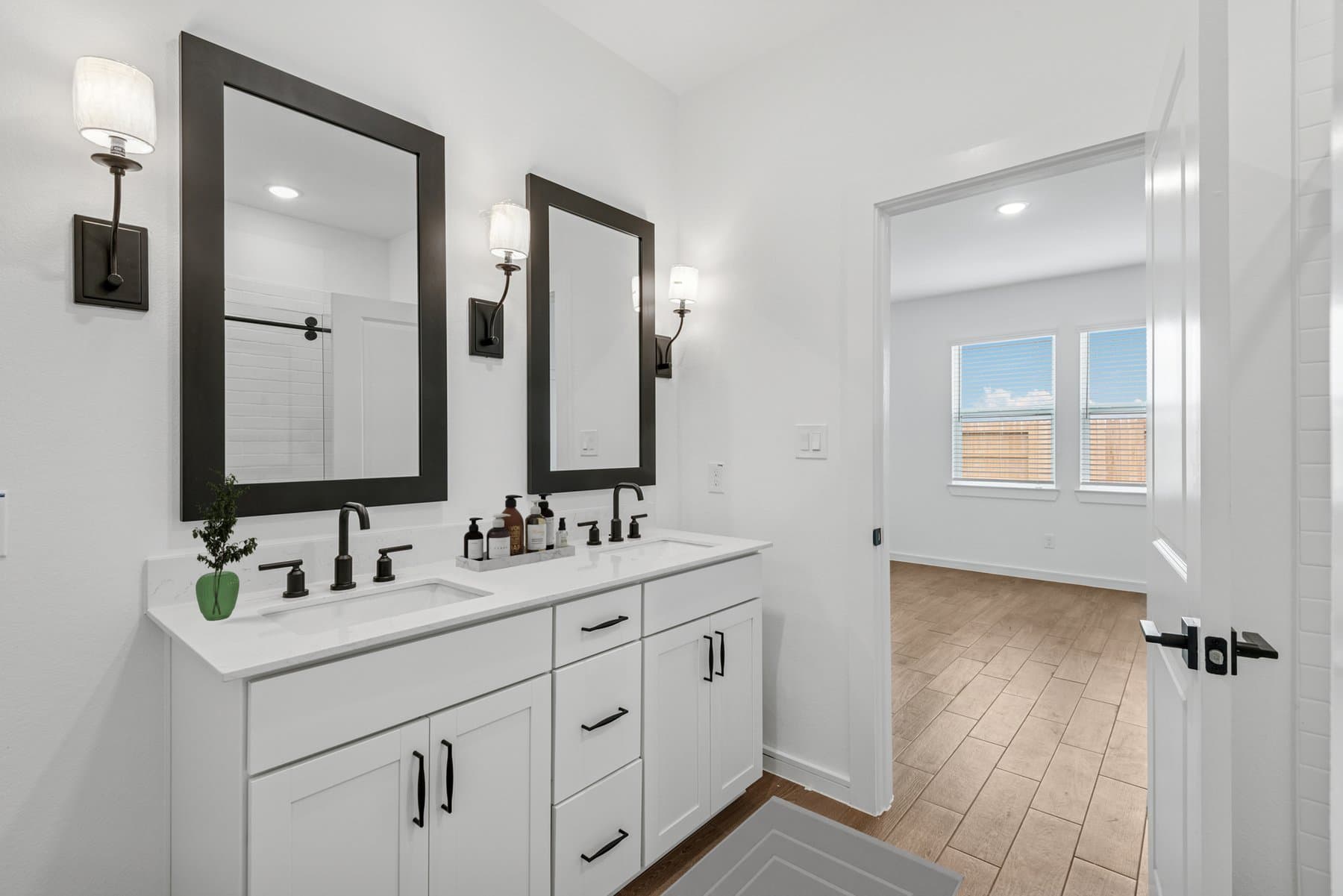 Primary bath features vanity with dual sinks