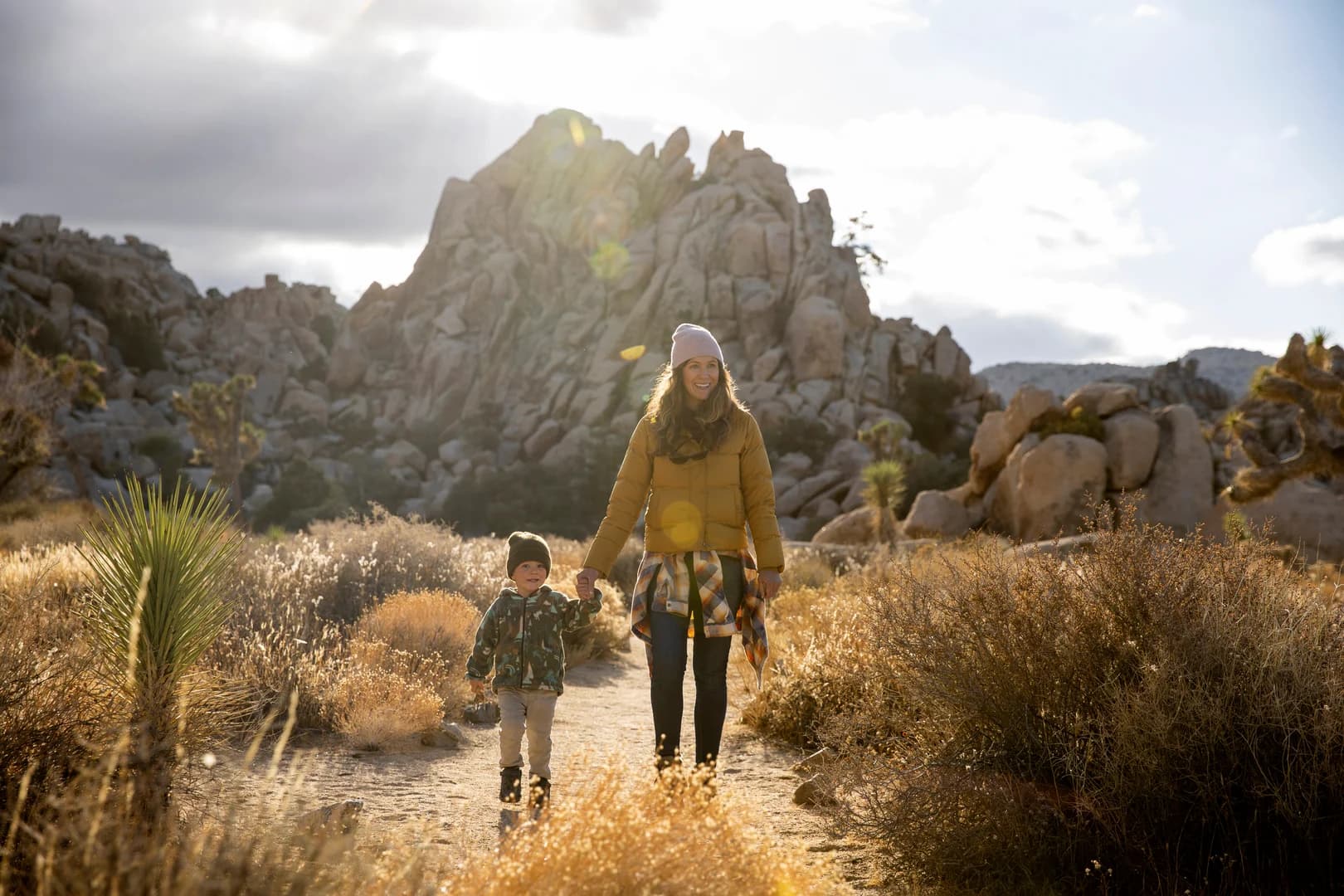 Mother and Young Boy Hiking in Desert