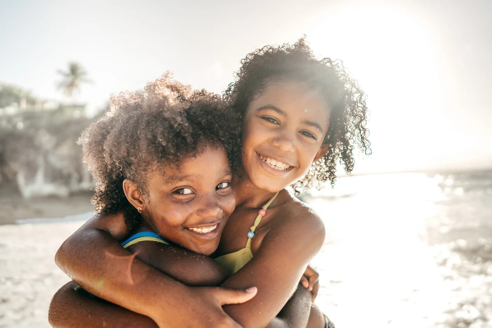 Happy African American girls on the beach