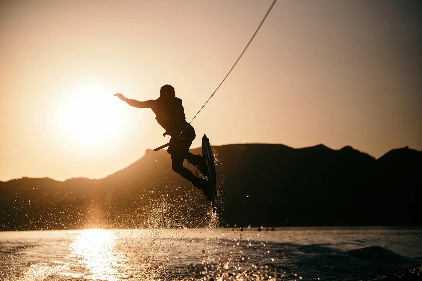 Person wake boarding on body of water