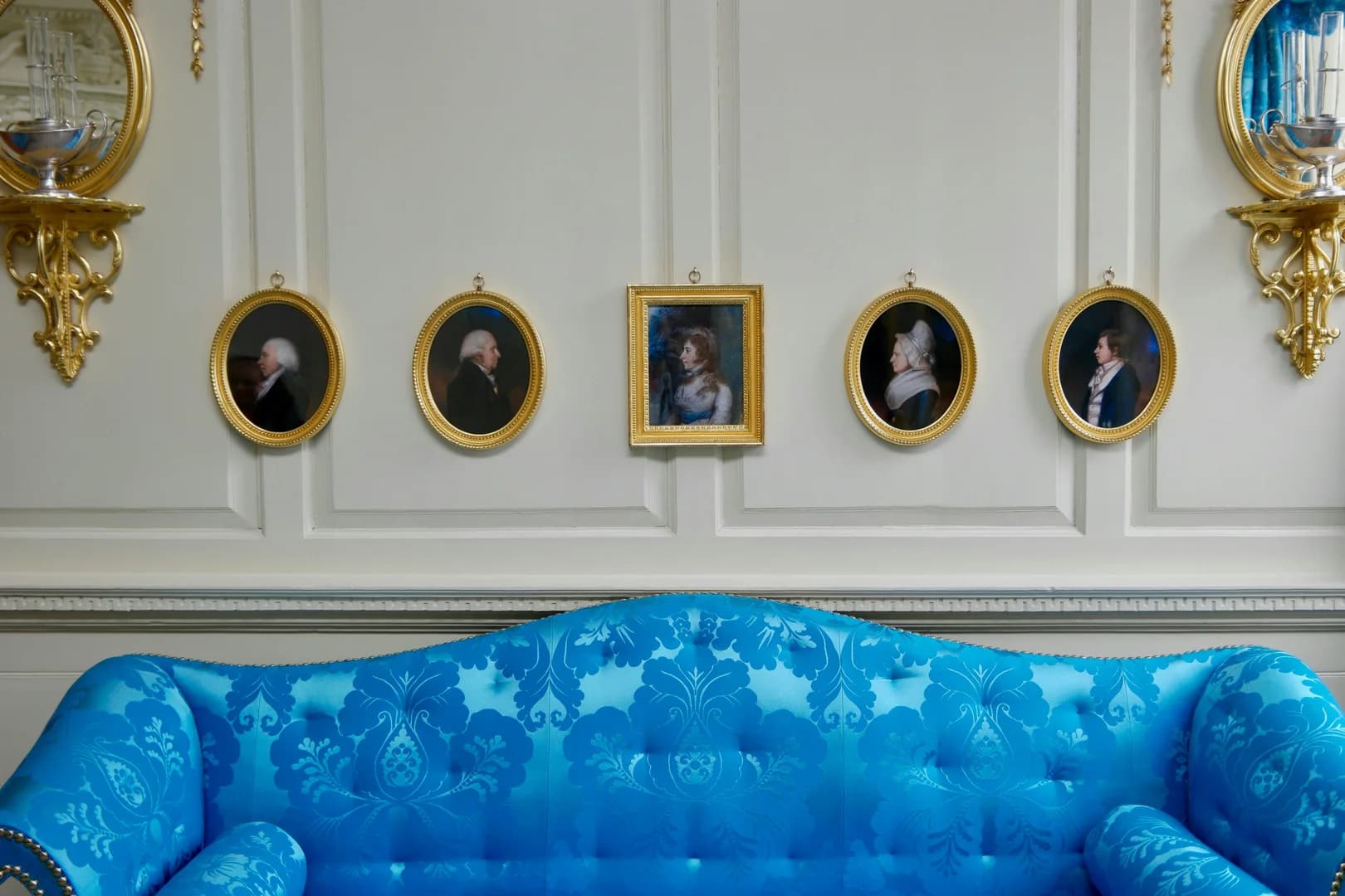 Historic Sofa and Portraits on Wall
