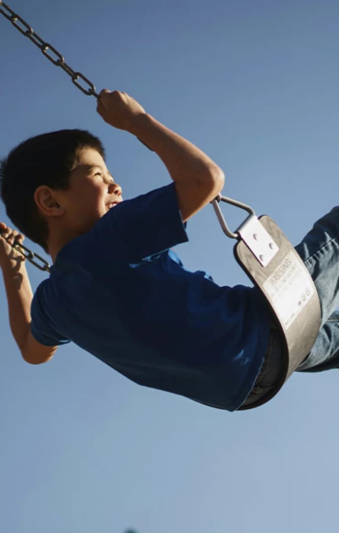 Kid on a swing