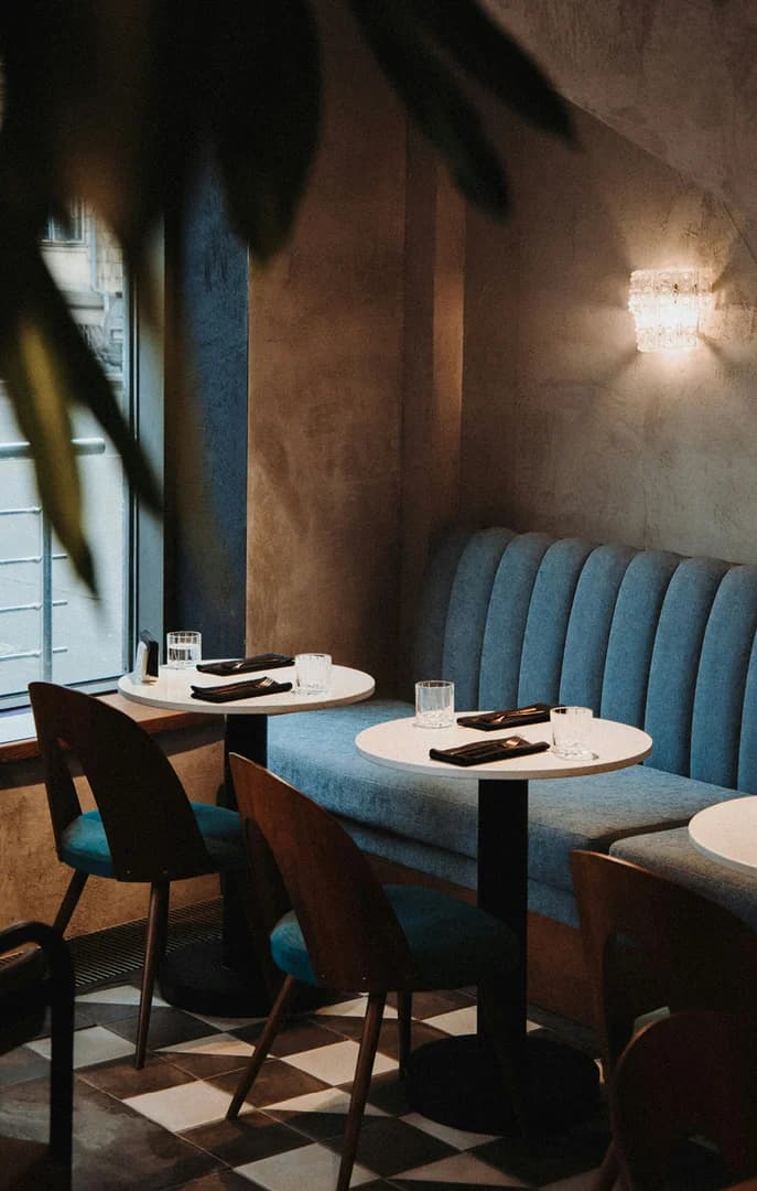 149234 Dining in a Cute Restaurant with Blue Tables Near Window USP Crop
