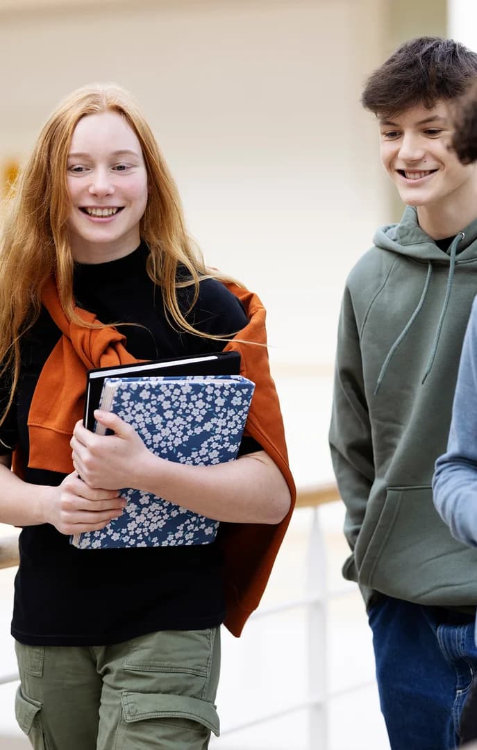 Students Walking in School Halls with Books