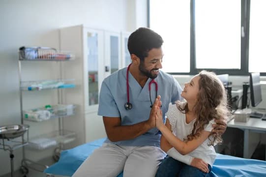Doctor or nurse with a child in a hospital