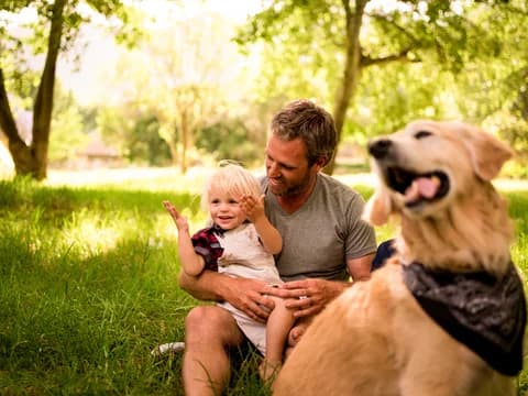 Dad and Baby Boy Play in Backyard
