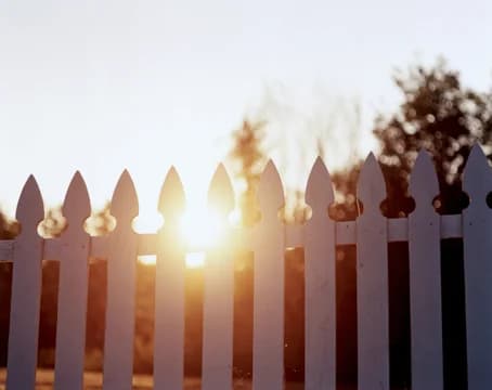 Picket Fence with Sun Setting