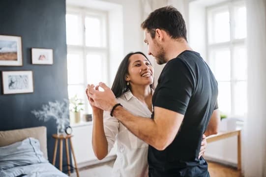 Couple Dancing in Bedroom