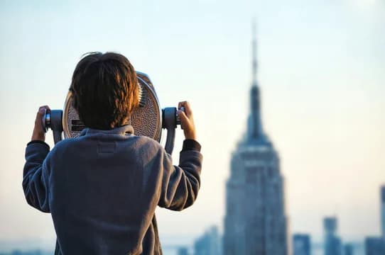 Little Boy Looking Through Binoculars at NYC