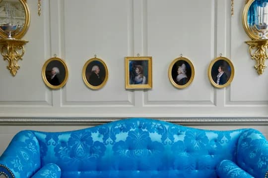 Historic Sofa and Portraits on Wall