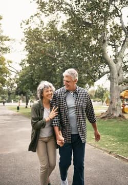 Older Couple Happy Walking in Park