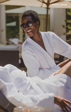 Older Women on Lounge Chairs by the Pool DCA USP Crop