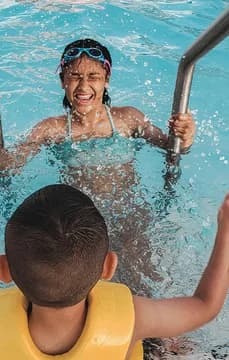 Water Fun Kids playing on pool steps