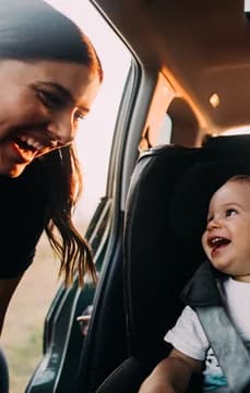 105623 Young family with one child going on a road trip with their car USP Crop