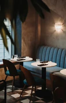 149234 Dining in a Cute Restaurant with Blue Tables Near Window USP Crop