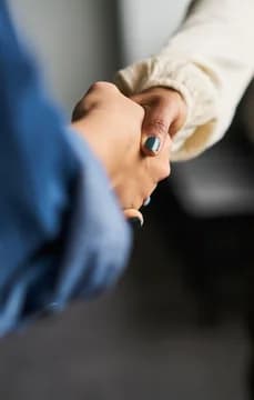 Business Women Shaking Hands Detail Shot USP Crop