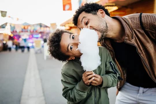 Family on a Boardwalk eating Cotton Candy