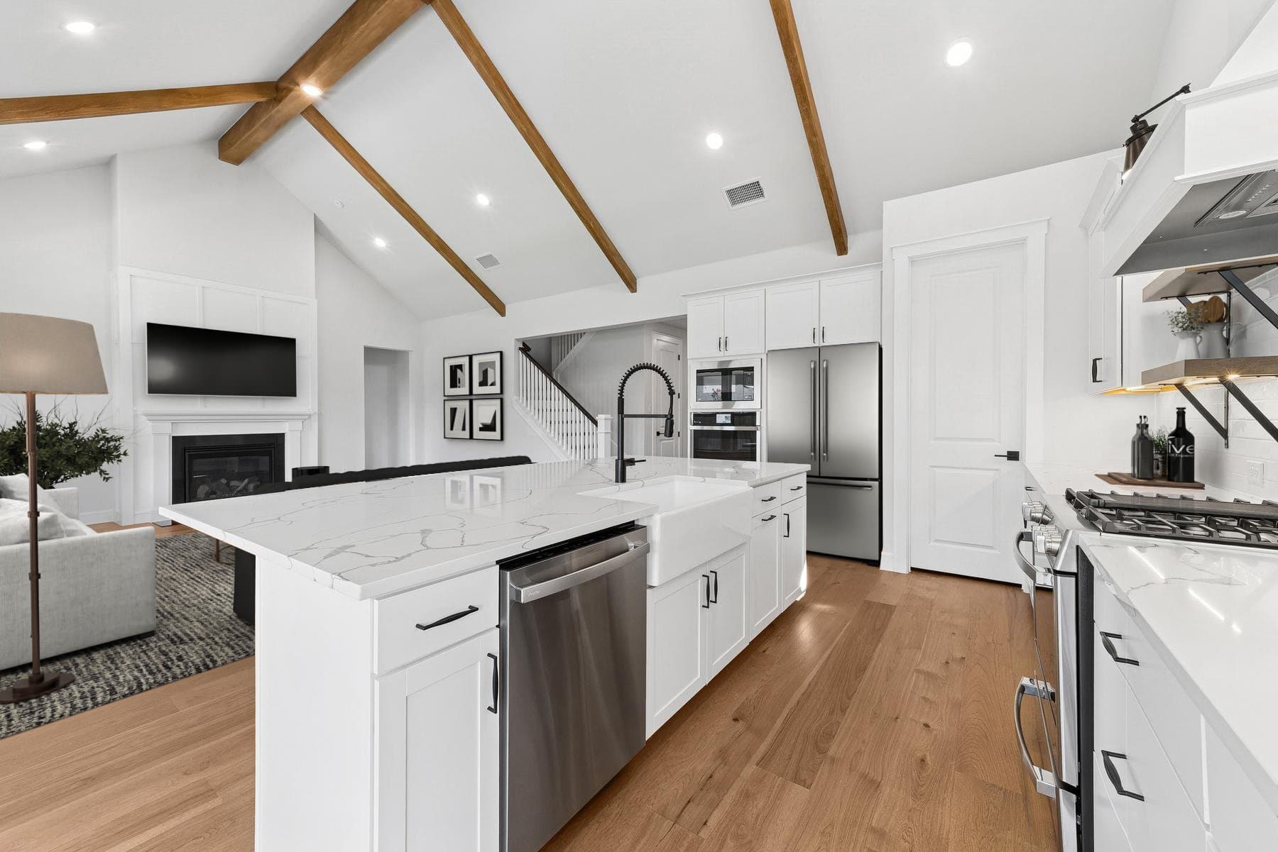 Kitchen featuring vaulted ceiling & stained ceiling beams