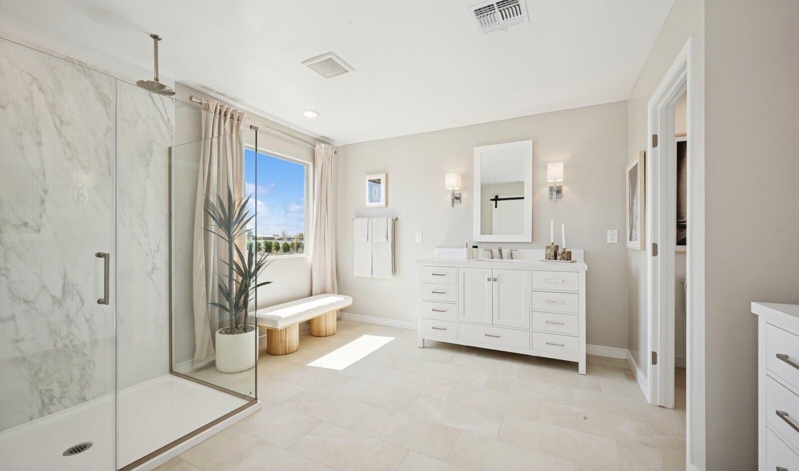 Primary bath with glass shower enclosure