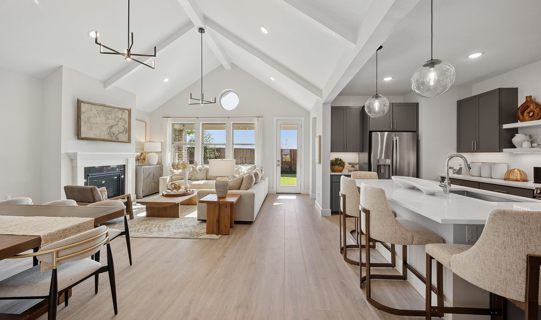 Great room with vaulted ceiling & white ceiling beams