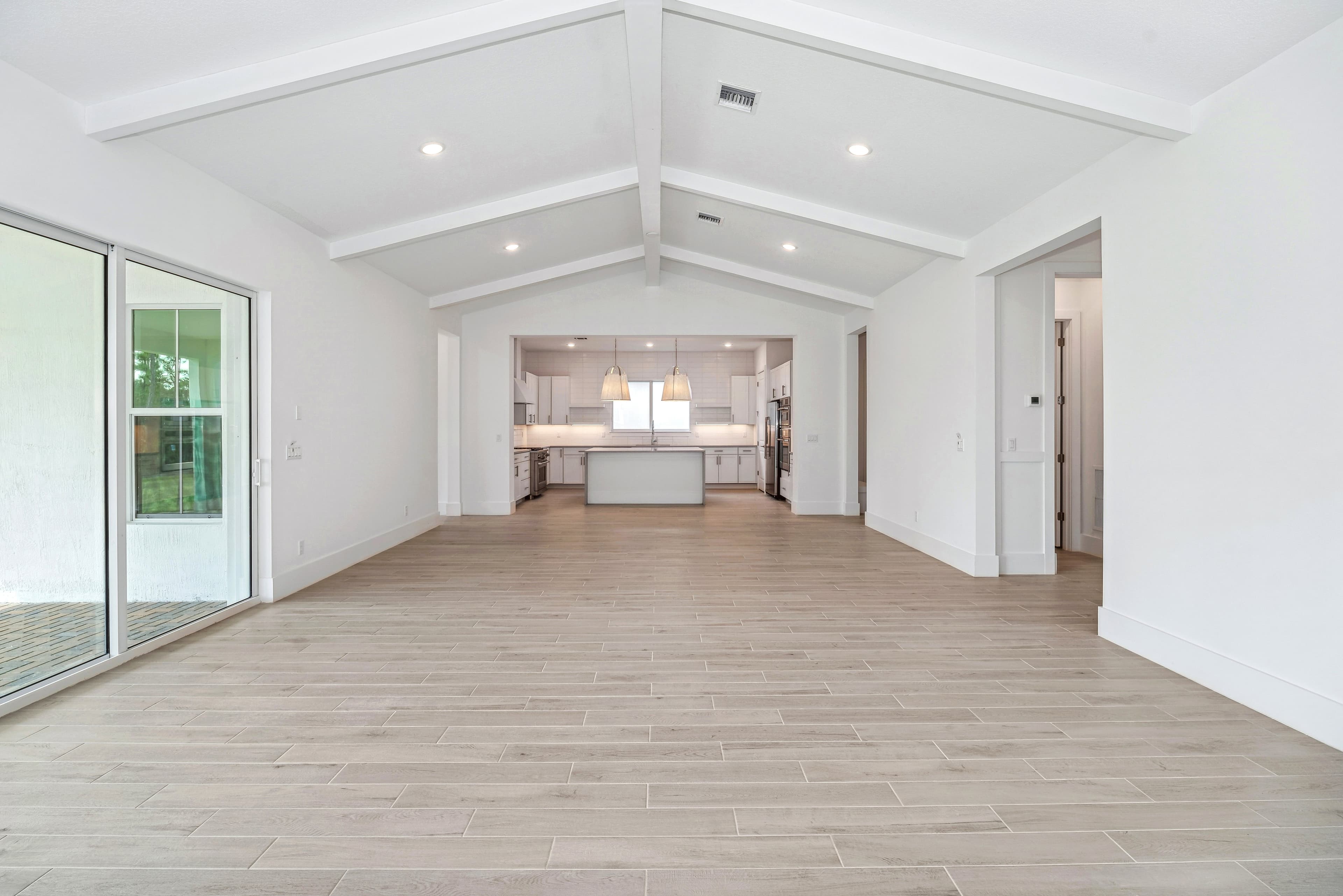 Open floorplan with vaulted ceiling & ceiling beams