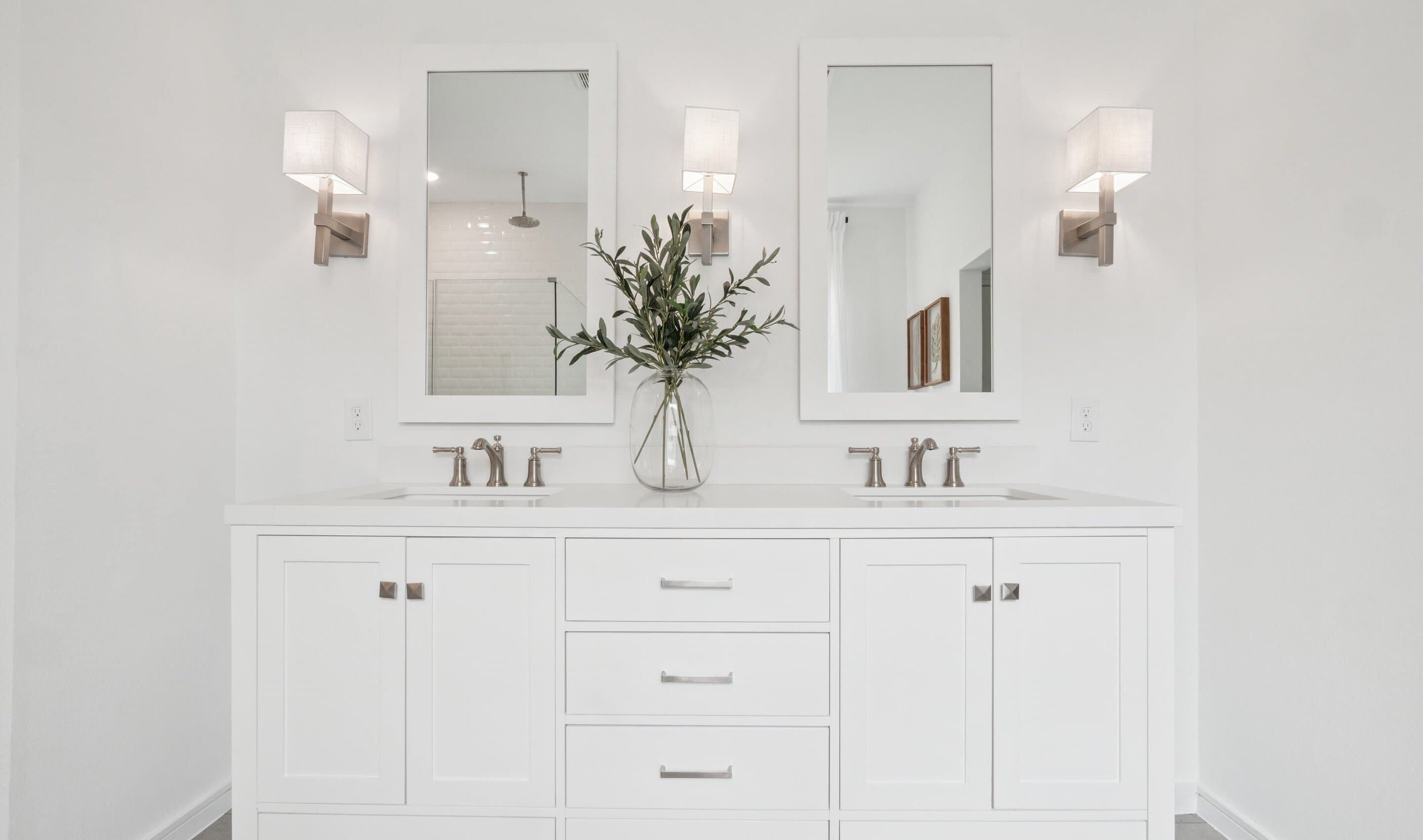 Primary bath features freestanding vanity with dual sinks