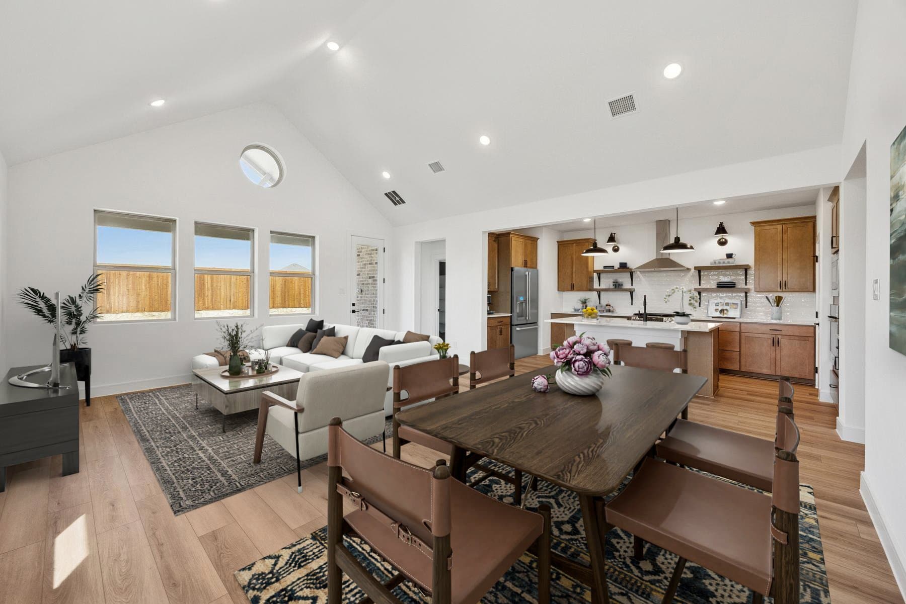 Open concept living spaces with vaulted ceiling