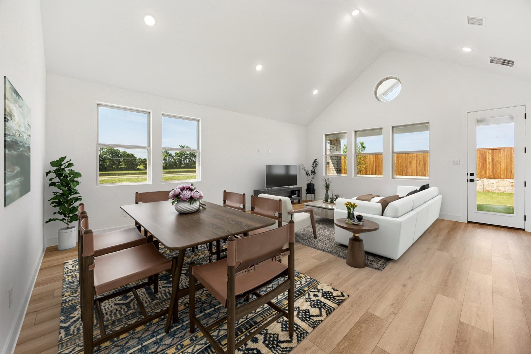 Open concept living spaces with vaulted ceiling