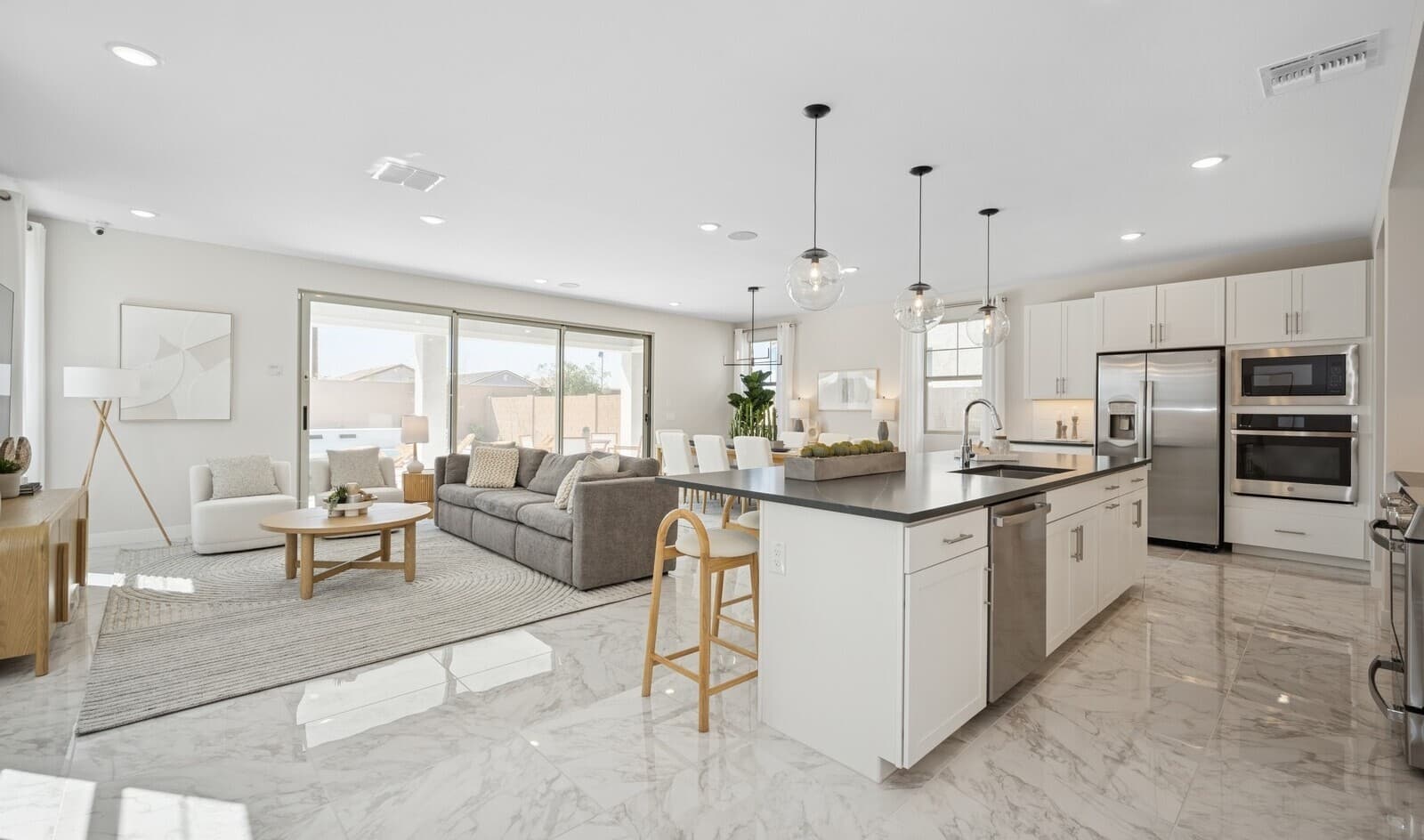 Bright and open great room with luxurious tile flooring