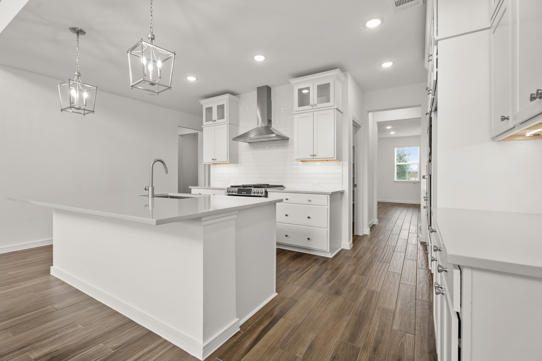 Kitchen featuring upper glass cabinets
